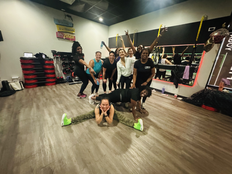 Zumba dance class with colorful workout attire at Core Ambitions