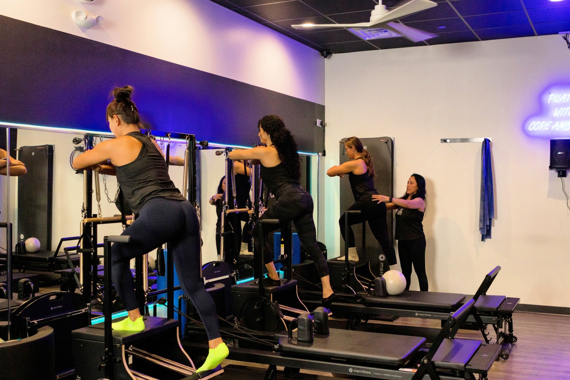 Pilates reformer class in session at Core Ambitions studio