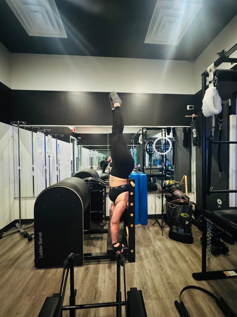 Handstand on the Ladder Barrel during an advanced private session at Core Ambitions