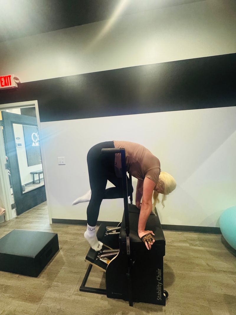 Stability Chair exercise during private Pilates session at Core Ambitions